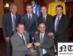 The Office bearers of Newry City AFC are pictured here presenting a memento to MLA Dominic Bradley, in recognition of Local MLA’s Karen McKevitt, Danny Kennedy, Mickey Brady and Dominic’s hard work in helping the club get back on it’s feet. Pictured  -  Top: Mickey Keenan (Coach), Raymond Byrne (Assistant manager), Darren Mullen (Manager) & Jervaise McCaul  (Coach). Bottom: Martin McLoughlin (Chairman) and MLA Dominic Bradley.