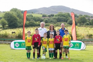 Camlough Rovers FC and Midway United footballers alongside Pat Jennings, Gillian Fitzpatrick (Chairperson) of Newry, Mourne and Down District Council and Seamus Heath from the Irish FA