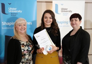 Niamh Downey is presented with the CIM Award for Excellence by sponsor representative Kathryn Pyper (right) watched by Course Director Dr Mary Boyd (left)